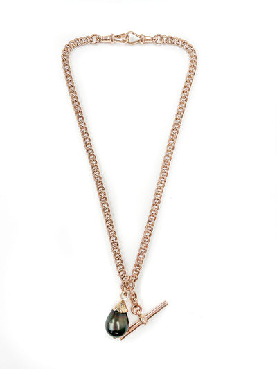 Unique pendant, crafted from recycled rose gold chain, an upcycled repurposed antique Victorian T-bar clasp and an eco-friendly black Tahitian pearl in a 'drop' setting embellished with reclaimed broken diamonds, secondary view