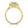 Lebrusan Studio Fancy Athena trilogy engagement ring with hand-engraved 18ct yellow Fairmined Eco Gold band and three emerald cut blue sapphires of ethical traceable origin, side view