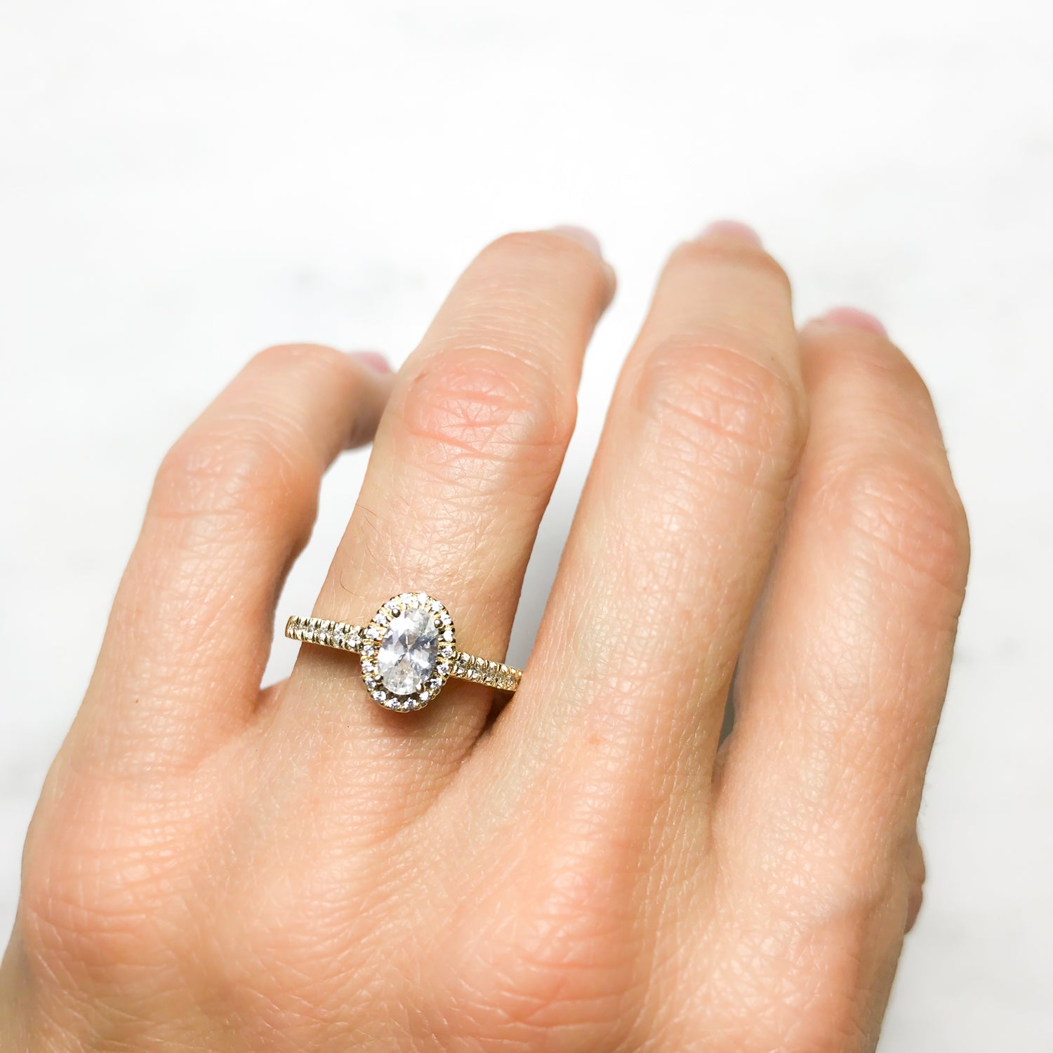 Oval halo gold engagement on sale ring